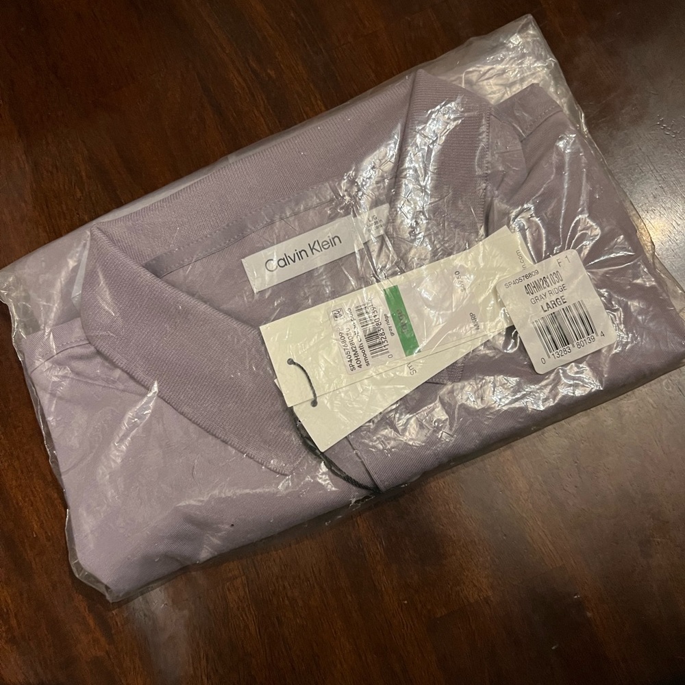 Brand New ck polo sz L